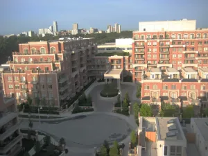 Front arial view of five story building.